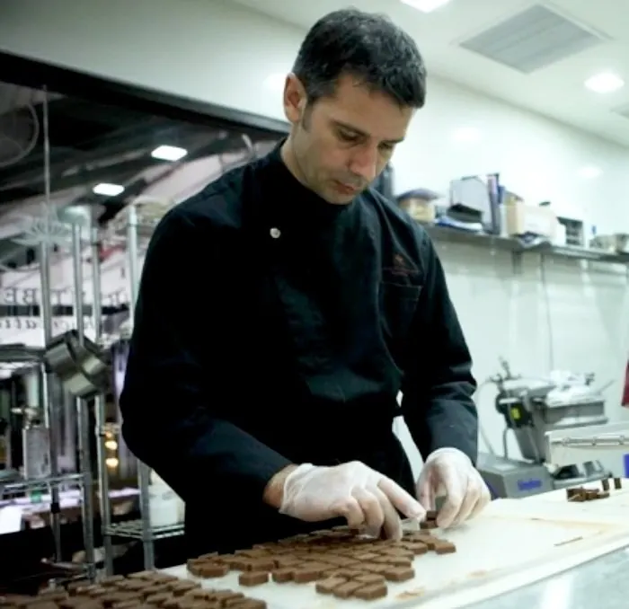 Chef Laurent Bernard working chocolate in his atelier